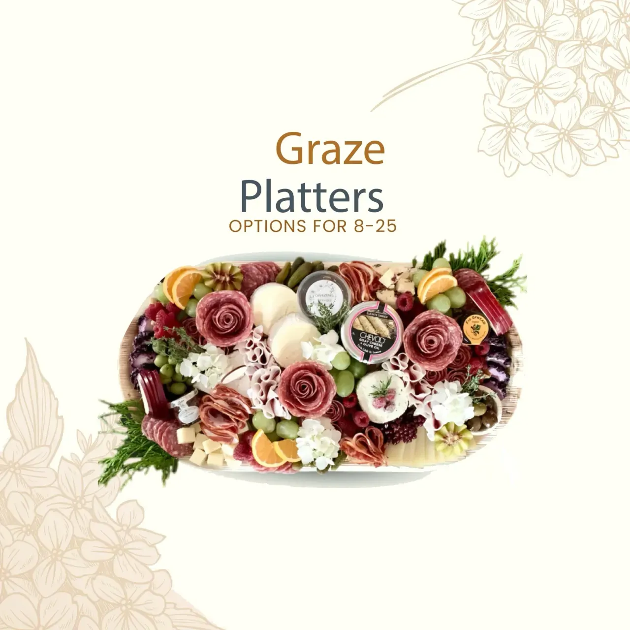 Graze platter with salami roses, cheeses, fruit, and florals